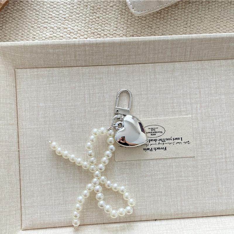 Pearl bow love pendant
