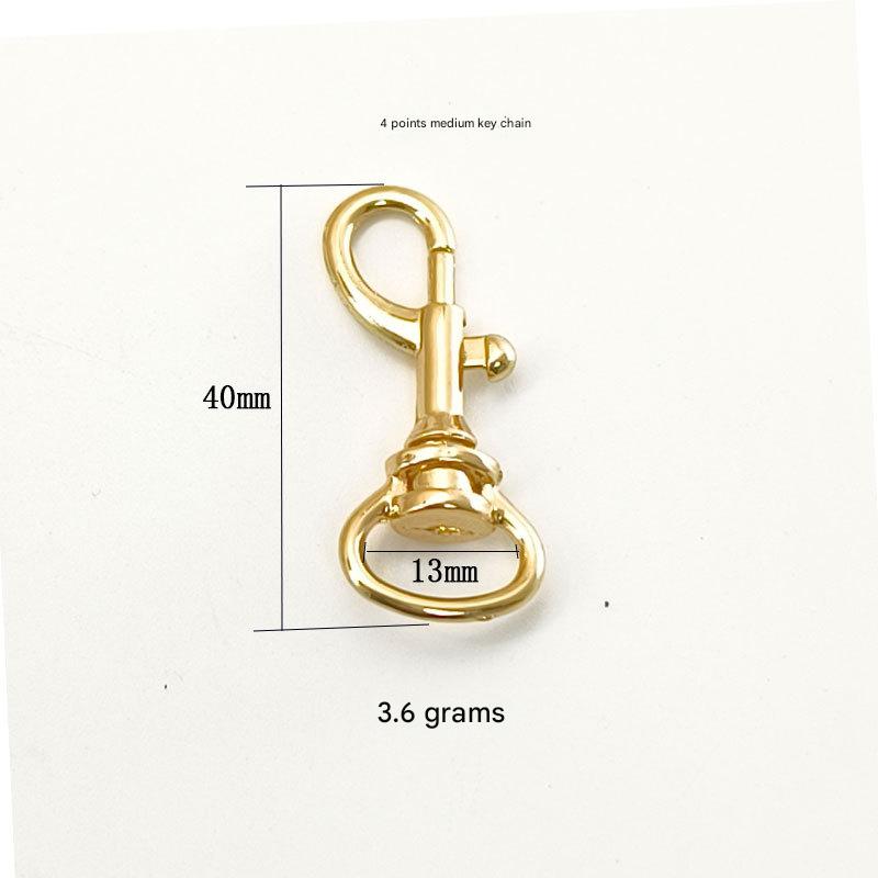 Hanging plated light gold 4 points medium keychain