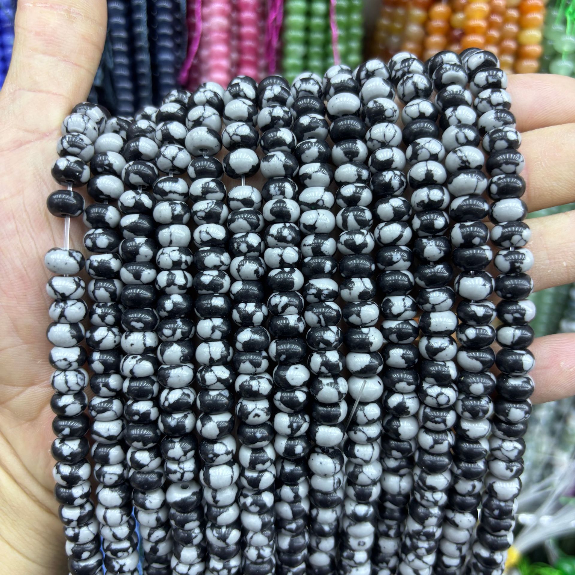 Synthetic black and white snowflake abacus beads