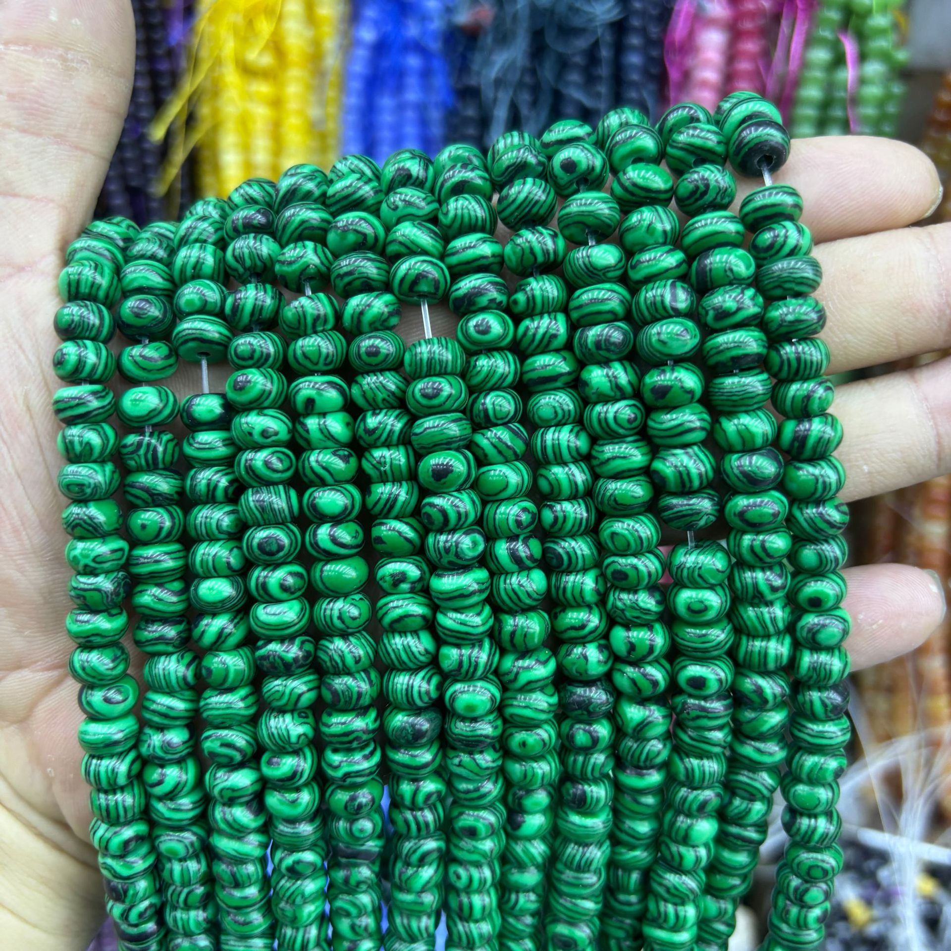 Synthetic peacock abacus beads