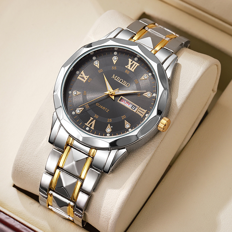 Two-tone gold and black dial with roman numerals