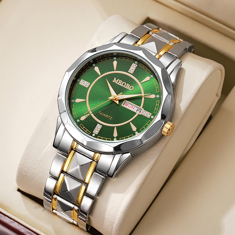 Two-tone gold and green dial with diamond accents