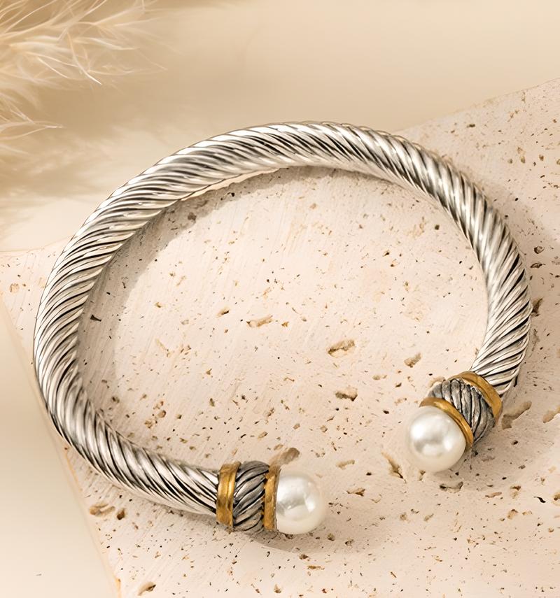 Gold between steel   white pearls