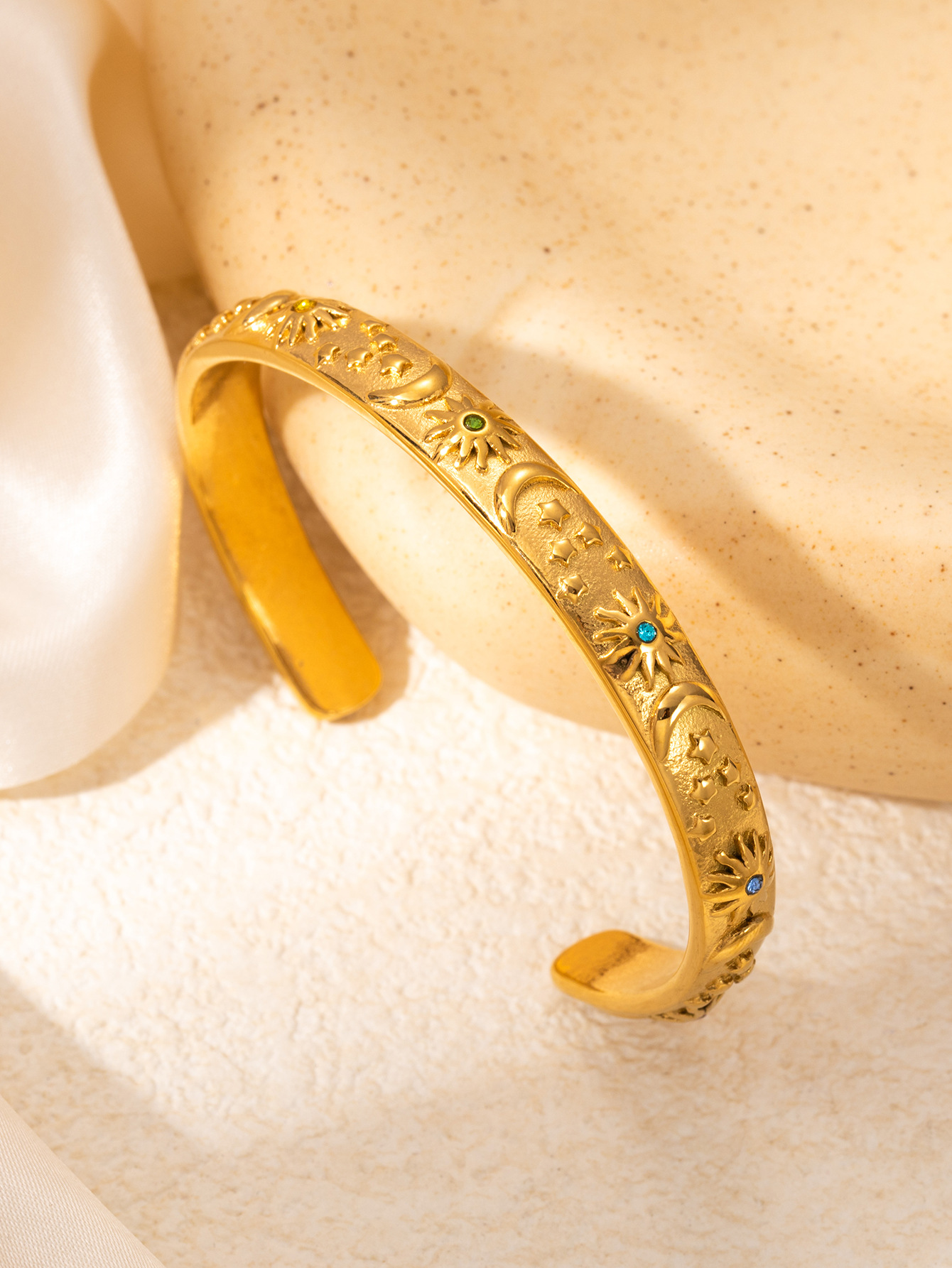 gold set with colored diamonds