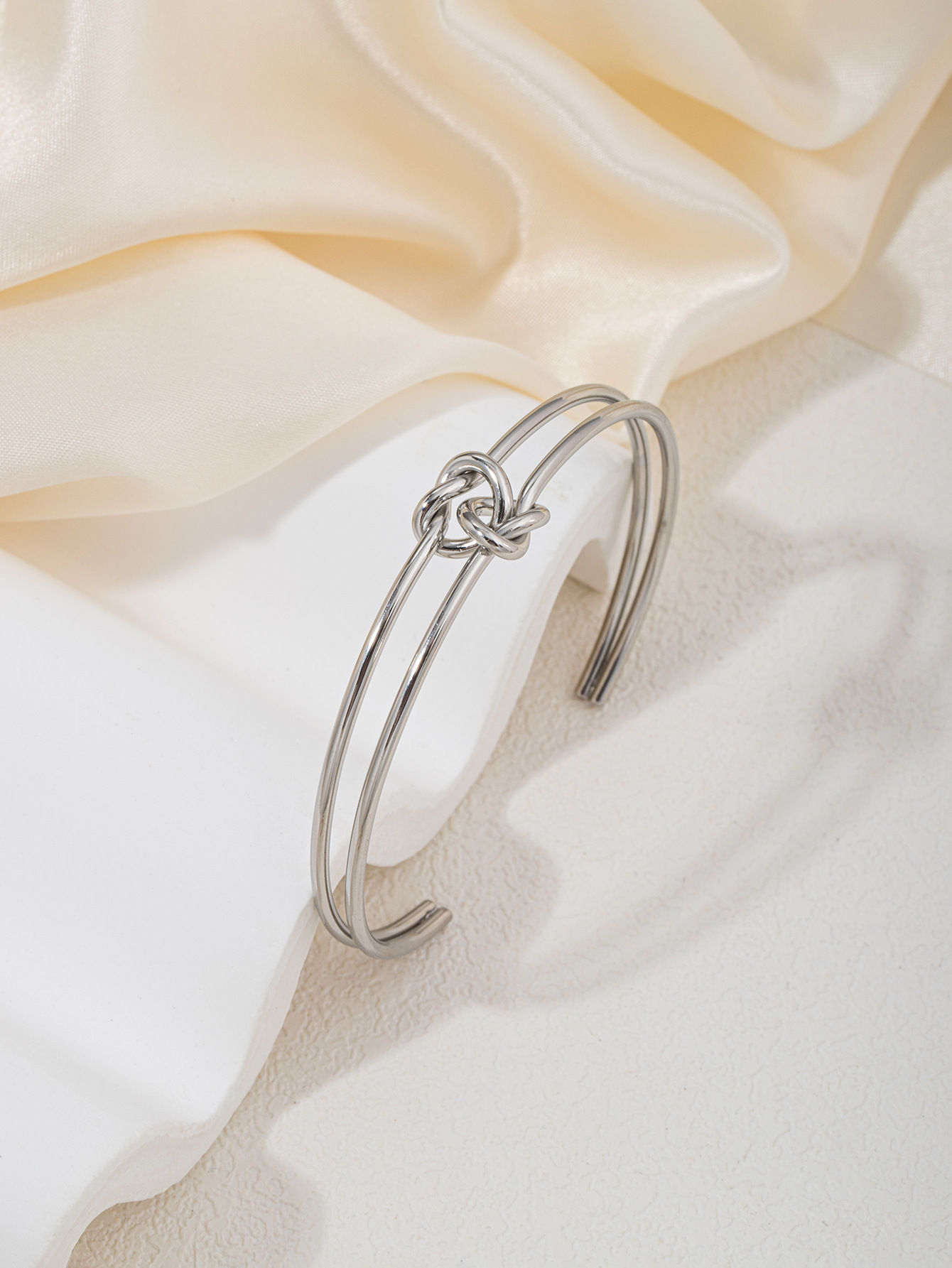 Double love knot-glossy-steel color