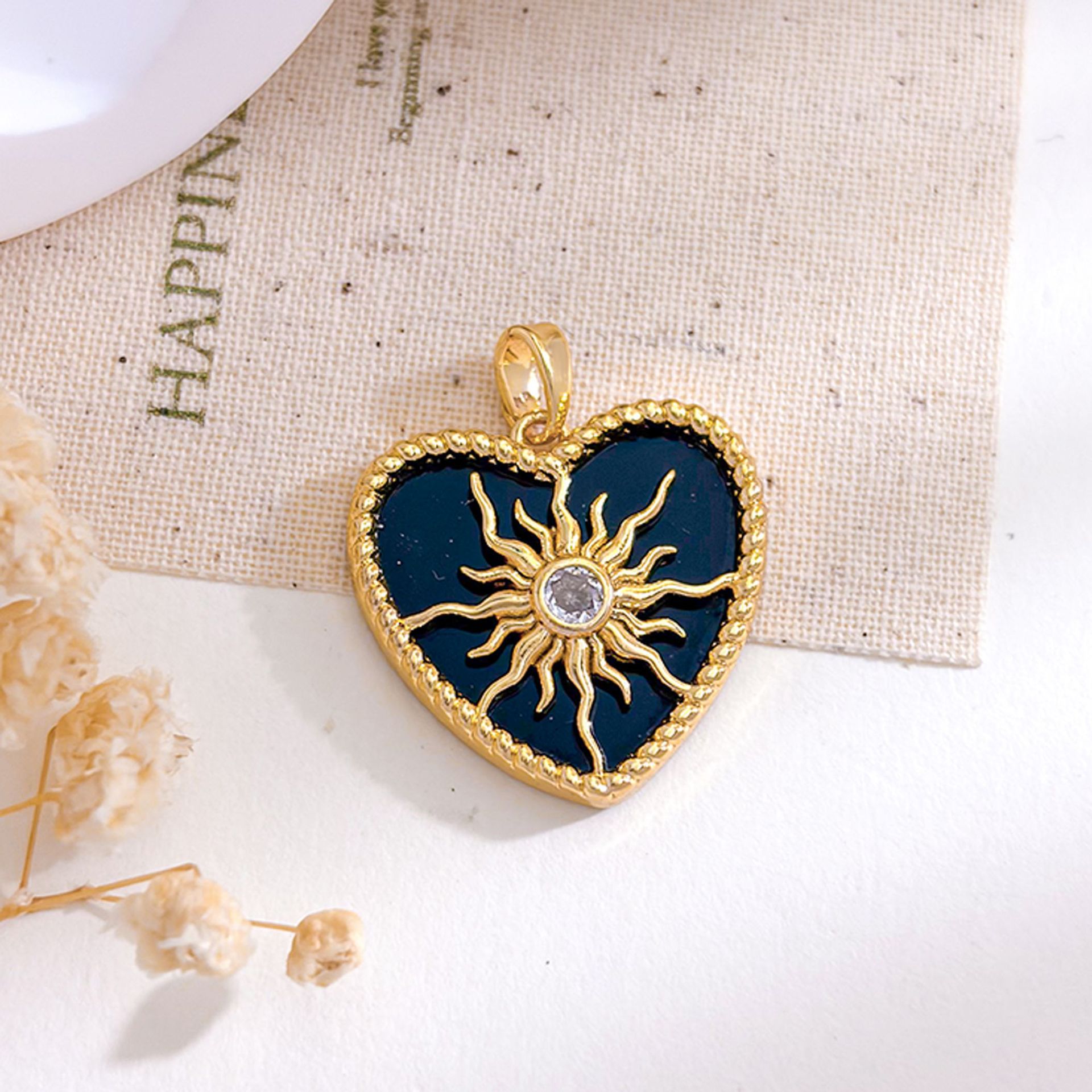 Xl5635 sun heart pendant gold black
