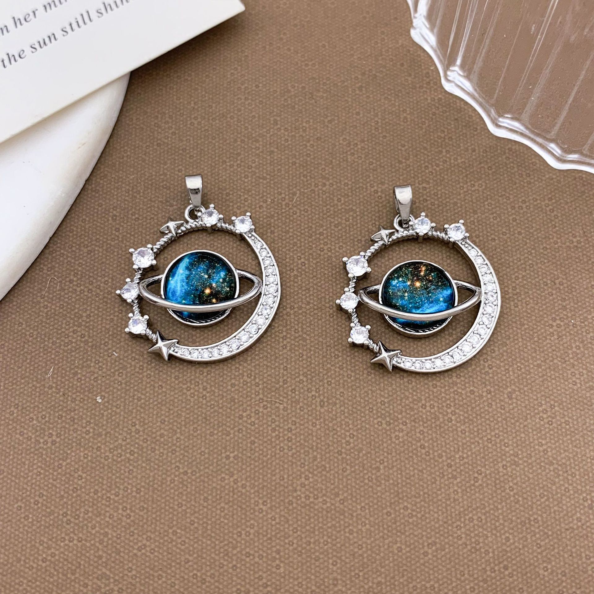 Xl1165 stars surrounding planet pendant silver large