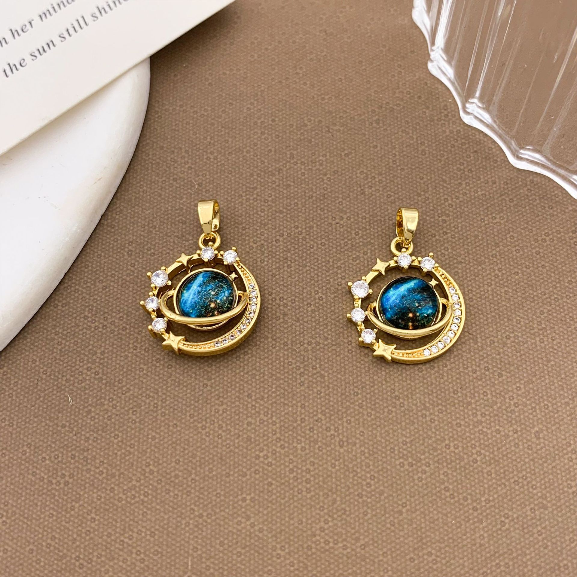Xl1844 stars surrounding planet pendant gold trumpet