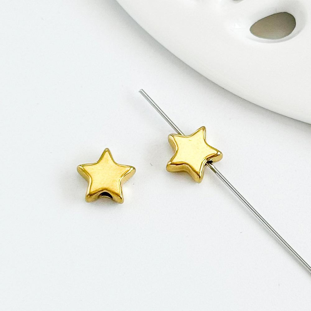 Golden five-pointed star 7x8mm