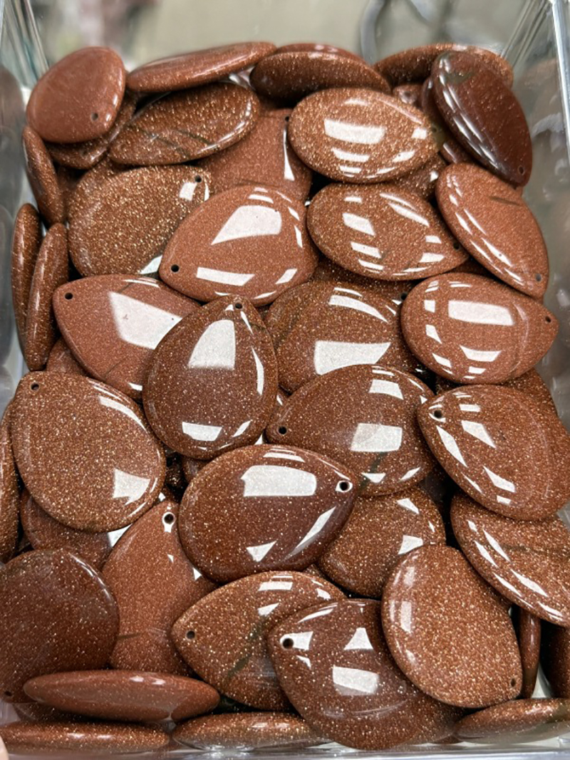 Synthetic gold sand