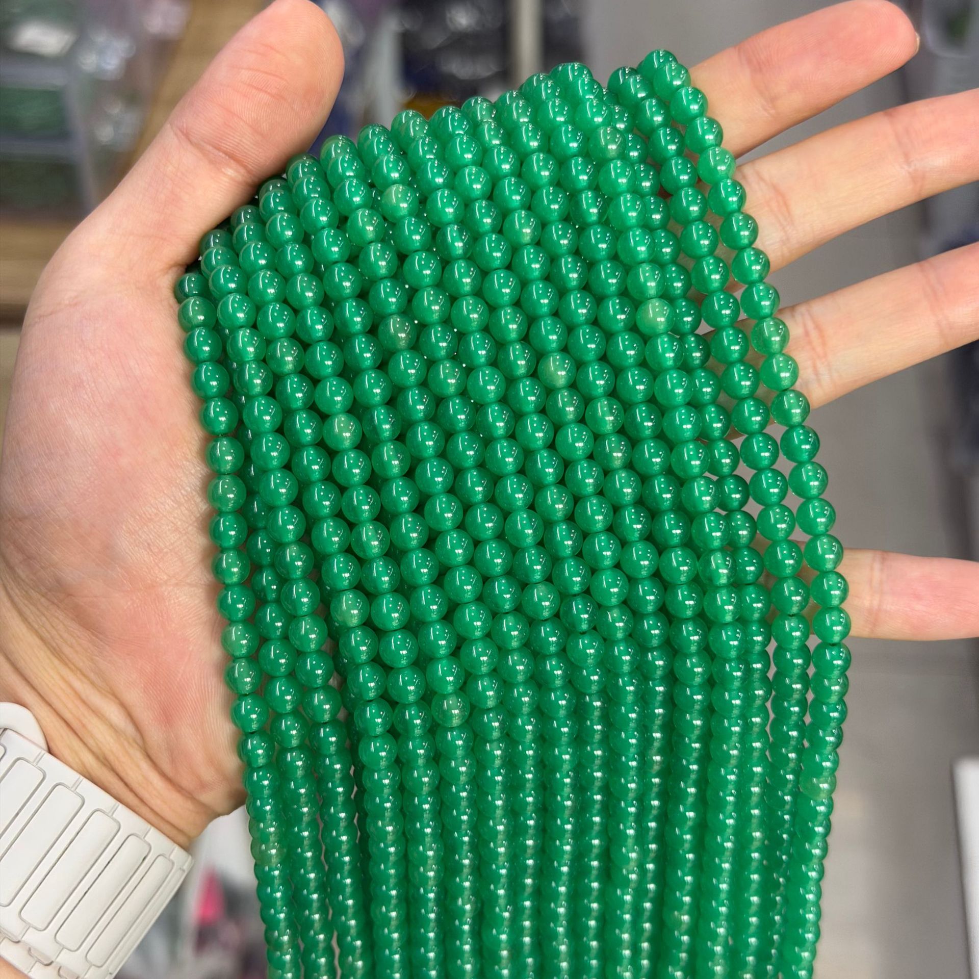 Lab-grown emeralds 6mm (approximately 60 pieces per strand)