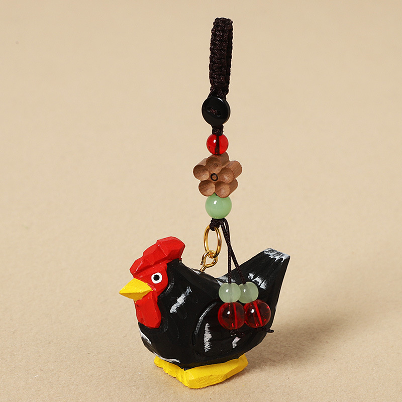 Wood-carved black chick - peach wood plum blossom design