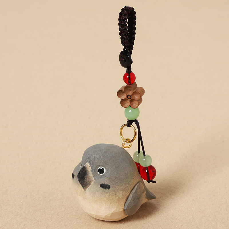 Wood carving gray parrot - peach wood plum blossom design