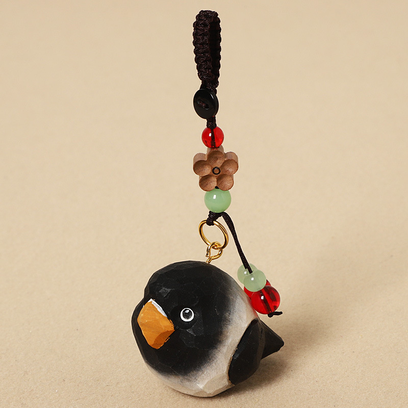 Wood carving charcoal black parrot - peach wood plum blossom design