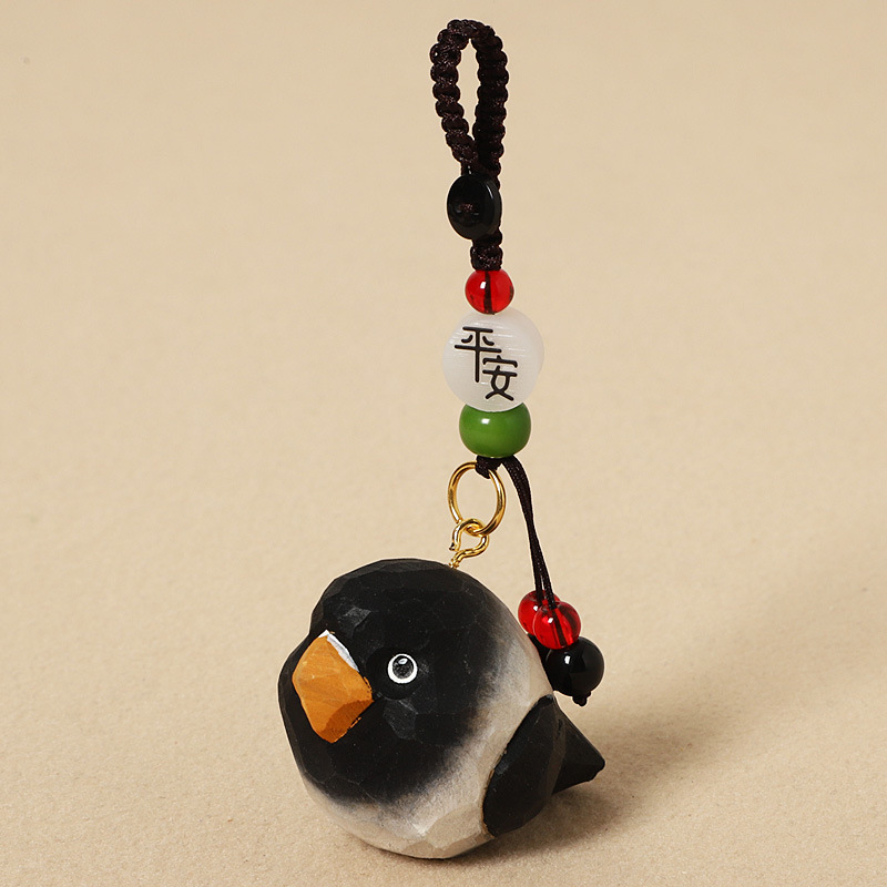 Wood carving charcoal black parrot - peace edition