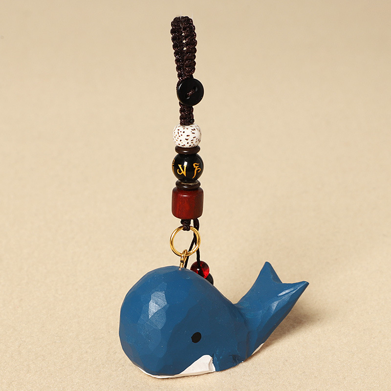 Wood carving blue whale-six-character mantra