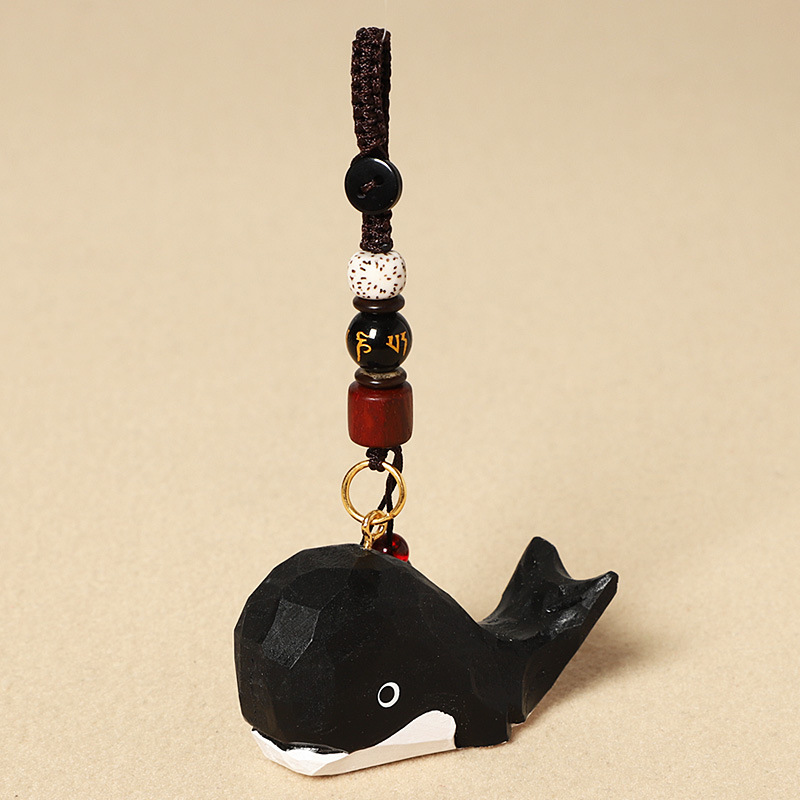 Wood carving black whale-six-character mantra