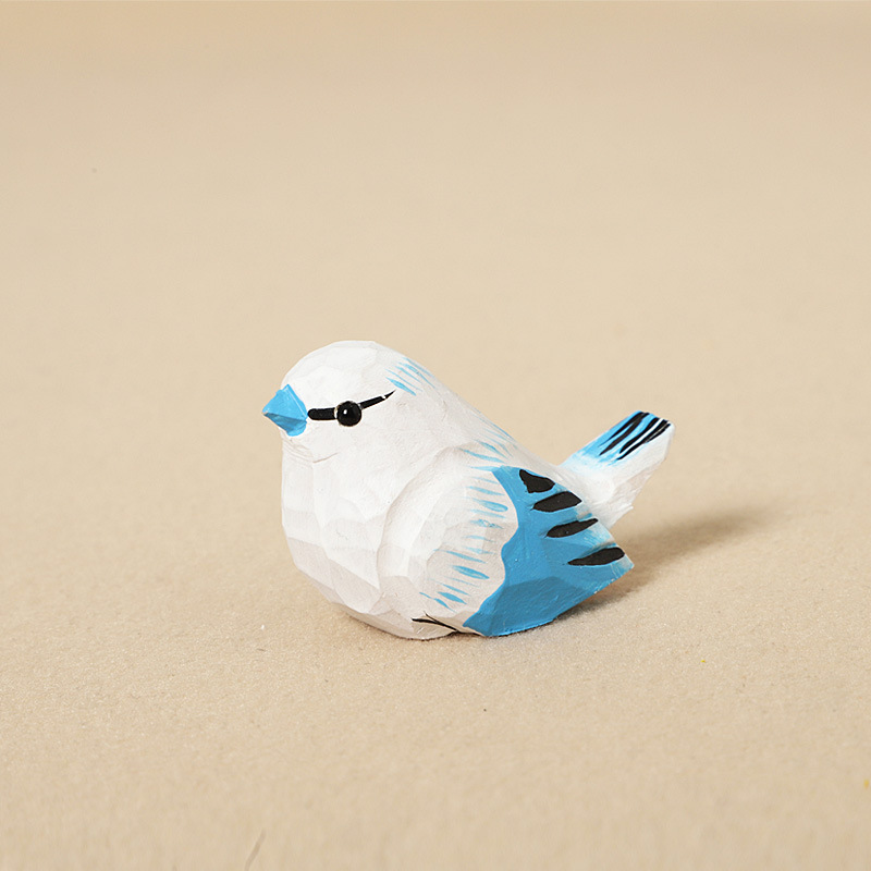 Wood carving small gray blue tit - ornament style