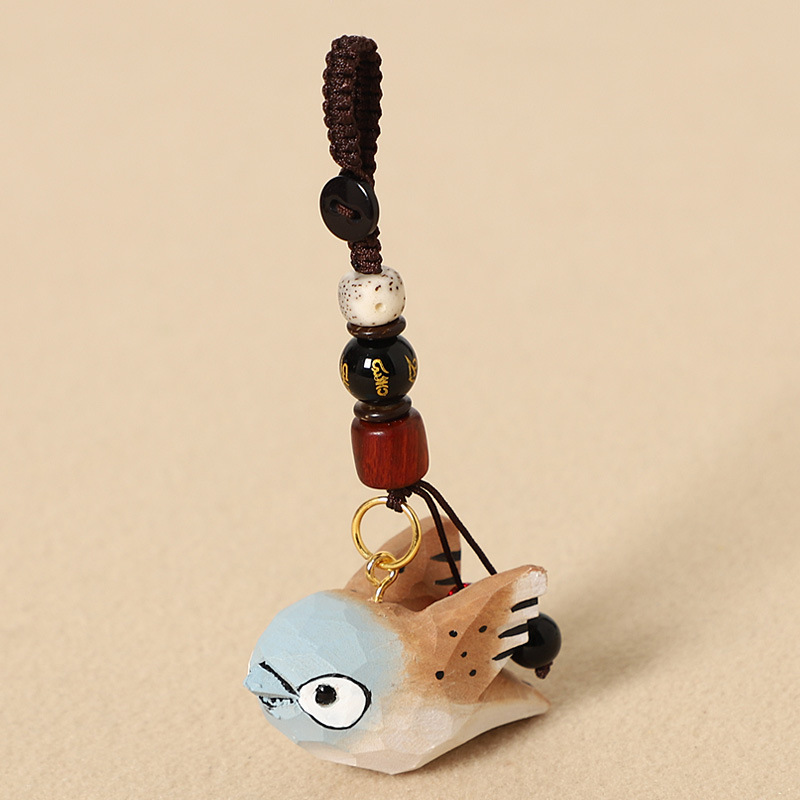 Wood-carved brown bird with wings - Six-character mantra design